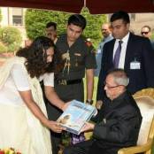 Prseident of India receiving Yatharth Geeta